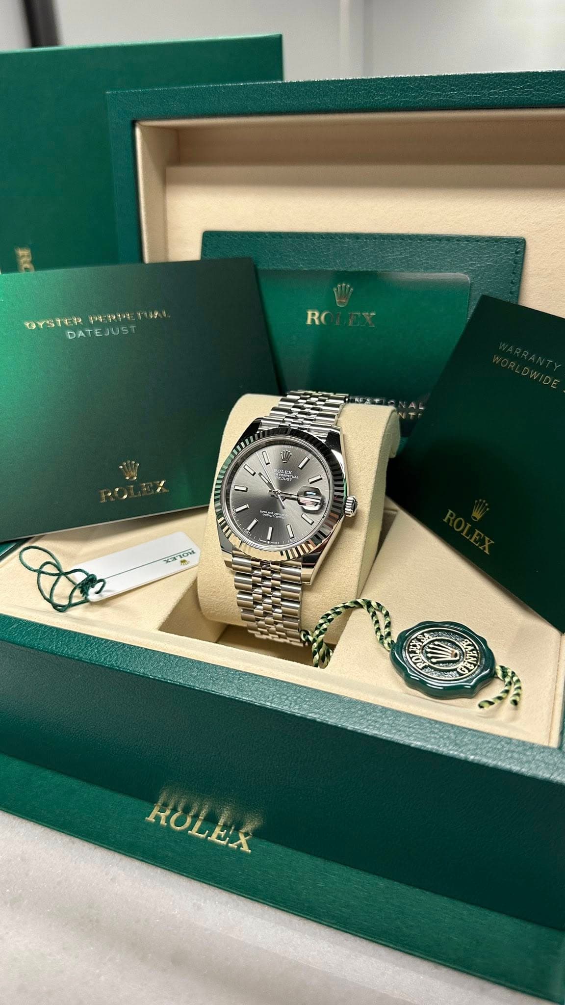 May be an image of wrist watch and text