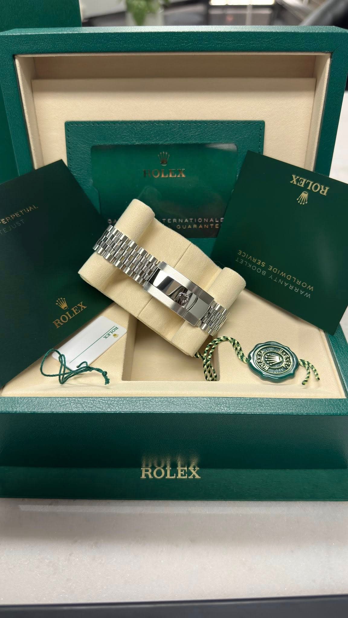 May be an image of wrist watch and text