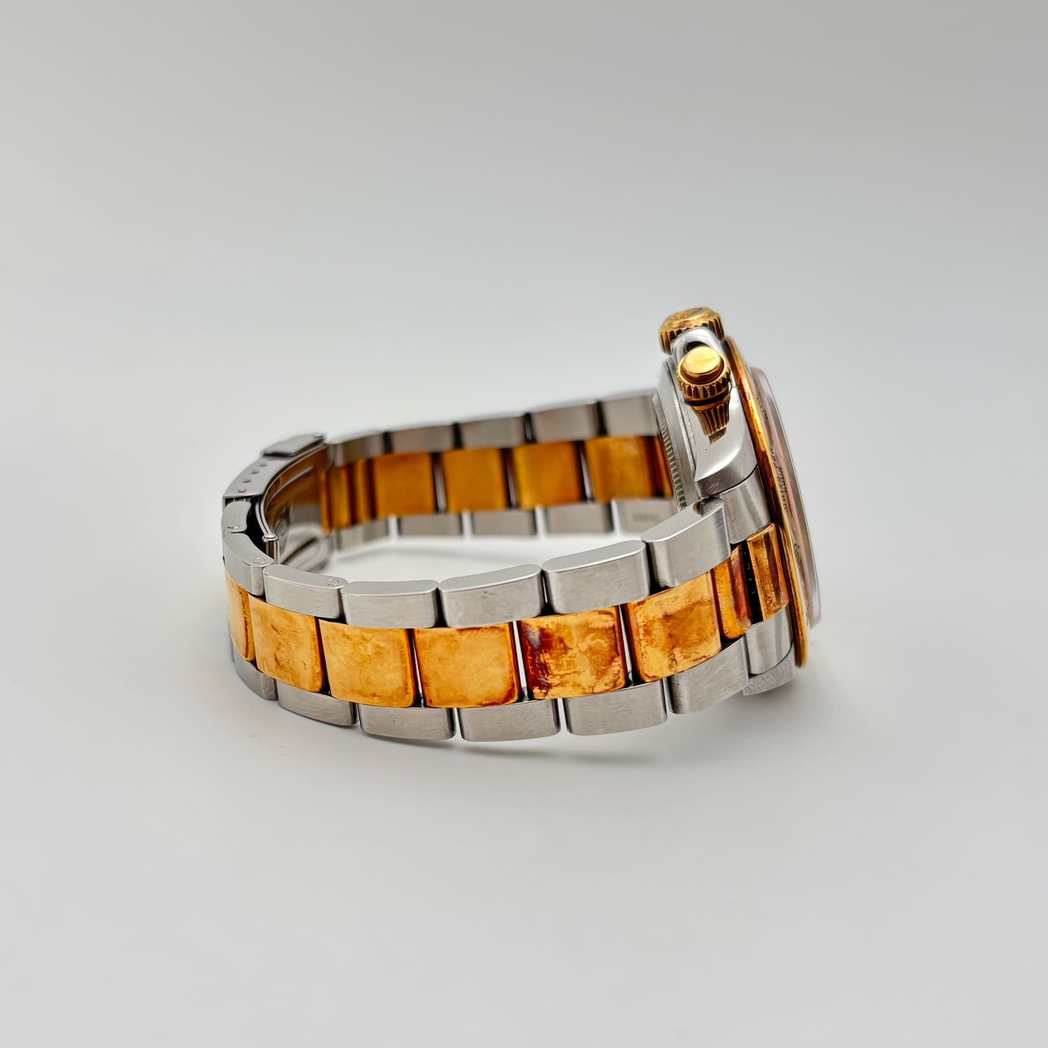 May be an image of jewelry and wrist watch