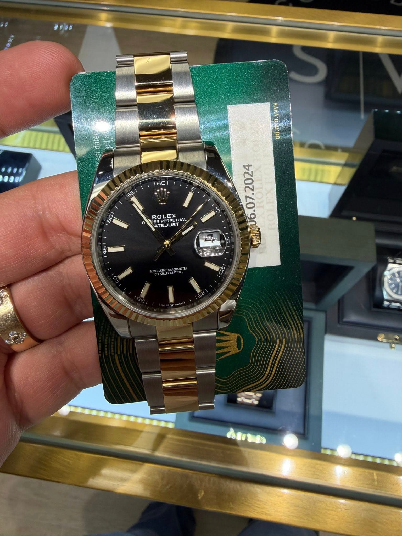 May be an image of wrist watch and text