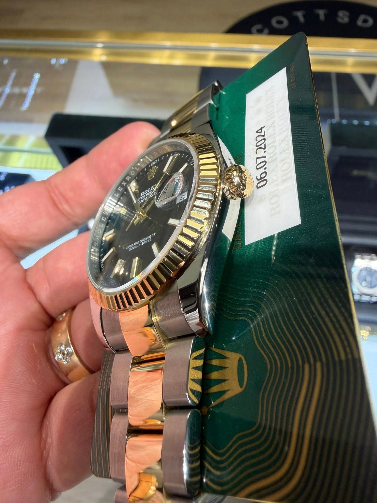 May be an image of wrist watch and text