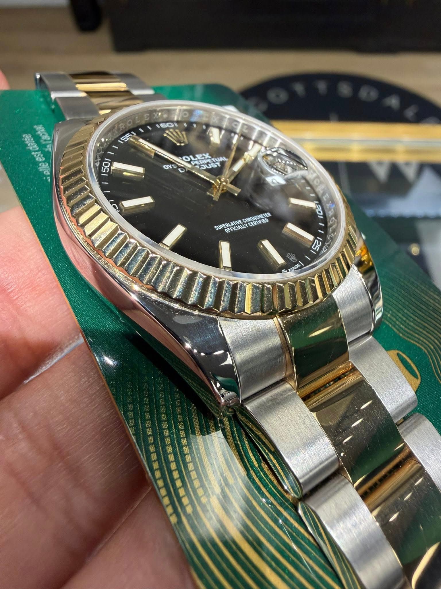 May be an image of wrist watch and text