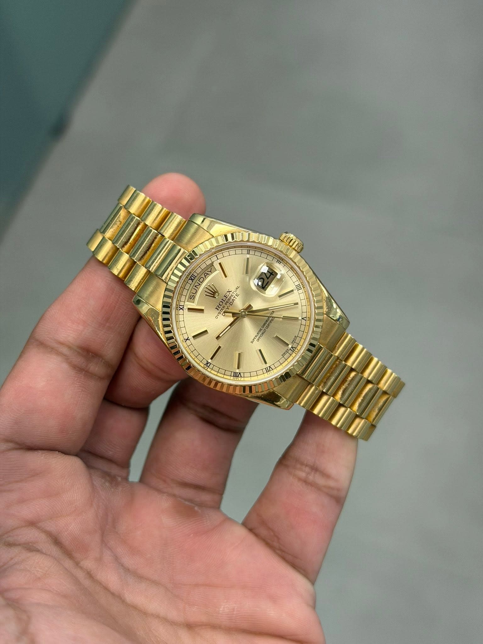 May be an image of wrist watch and text