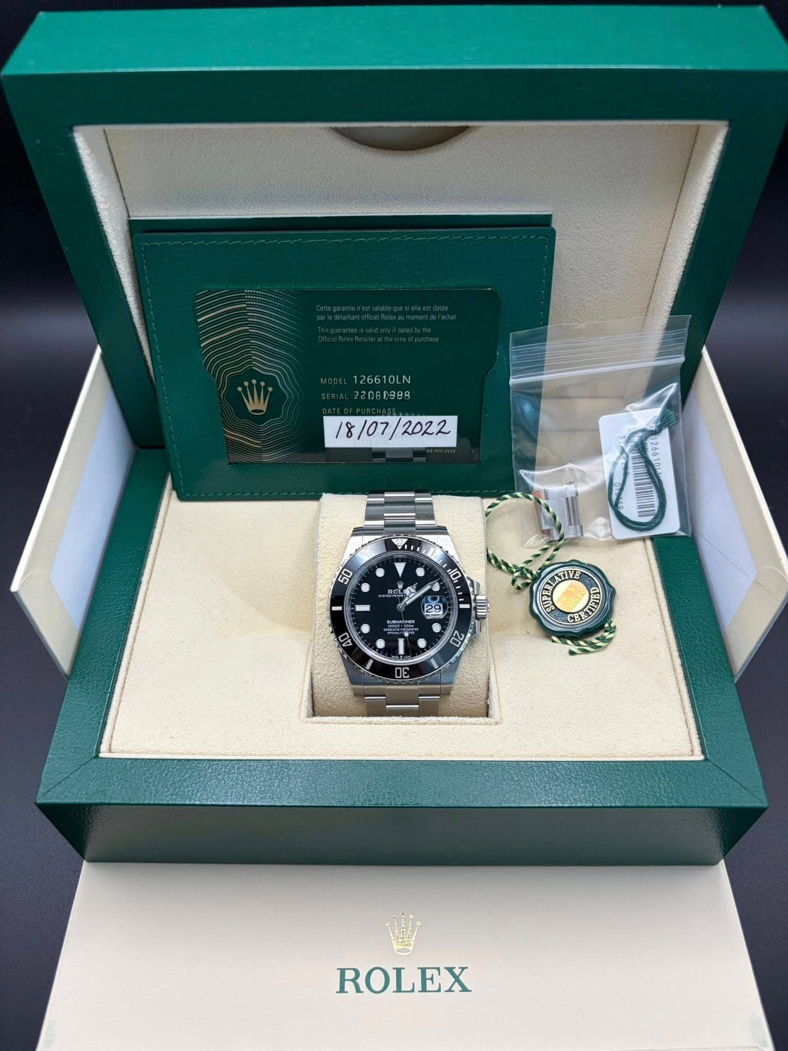 May be an image of wrist watch and text that says '26610LN /07/ / /2022 /8/07/ 50 10, שוצבה 20 ROLEX'