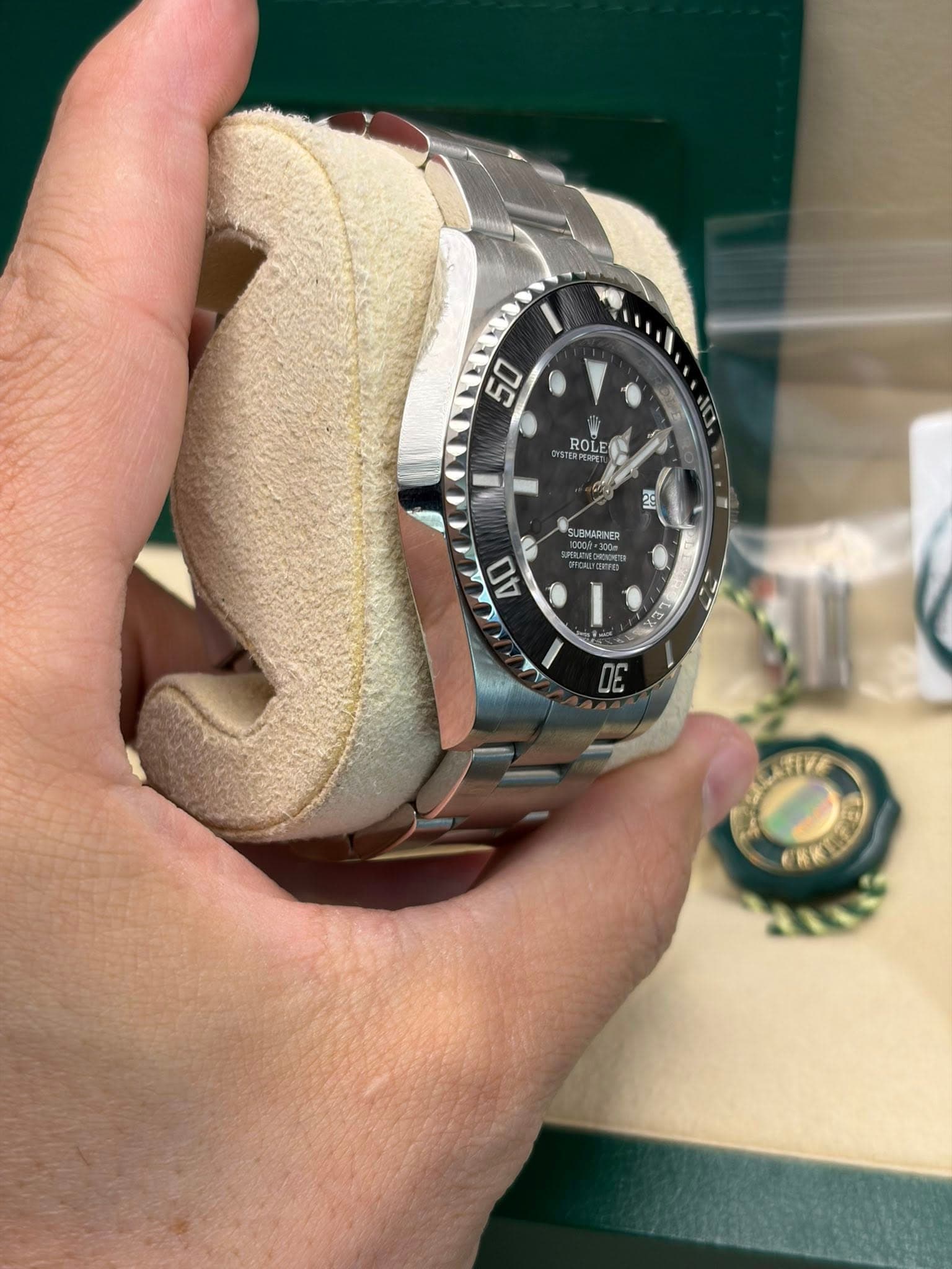 May be an image of wrist watch and text that says '50 ROLE २ट ENARINER 40 I - اح ግ DE'