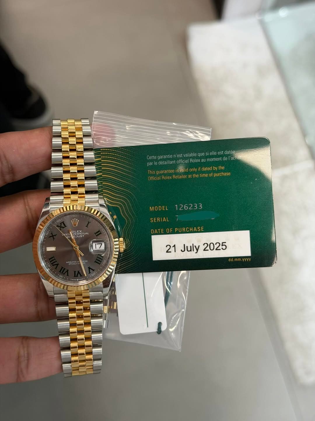 May be an image of wrist watch and text