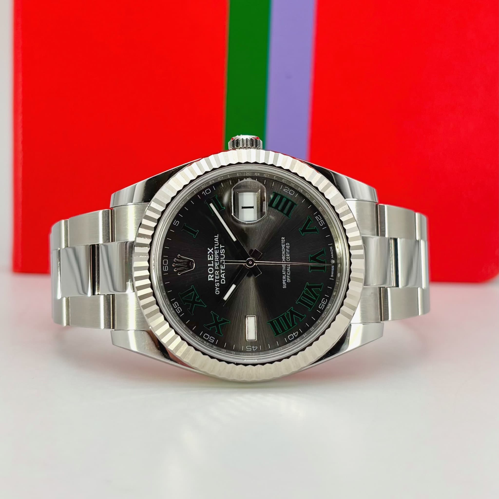 May be an image of wrist watch and text
