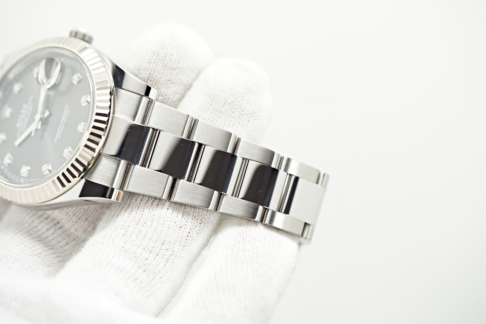 May be an image of wrist watch and text