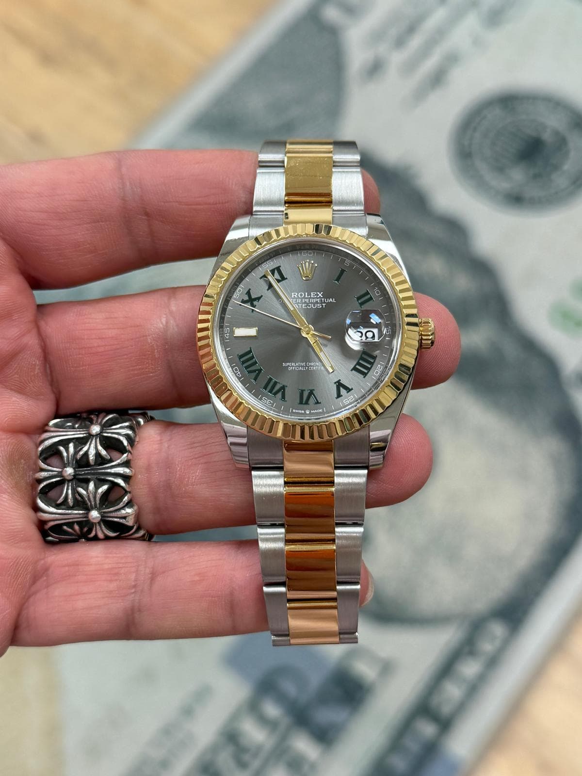 May be an image of wrist watch and text