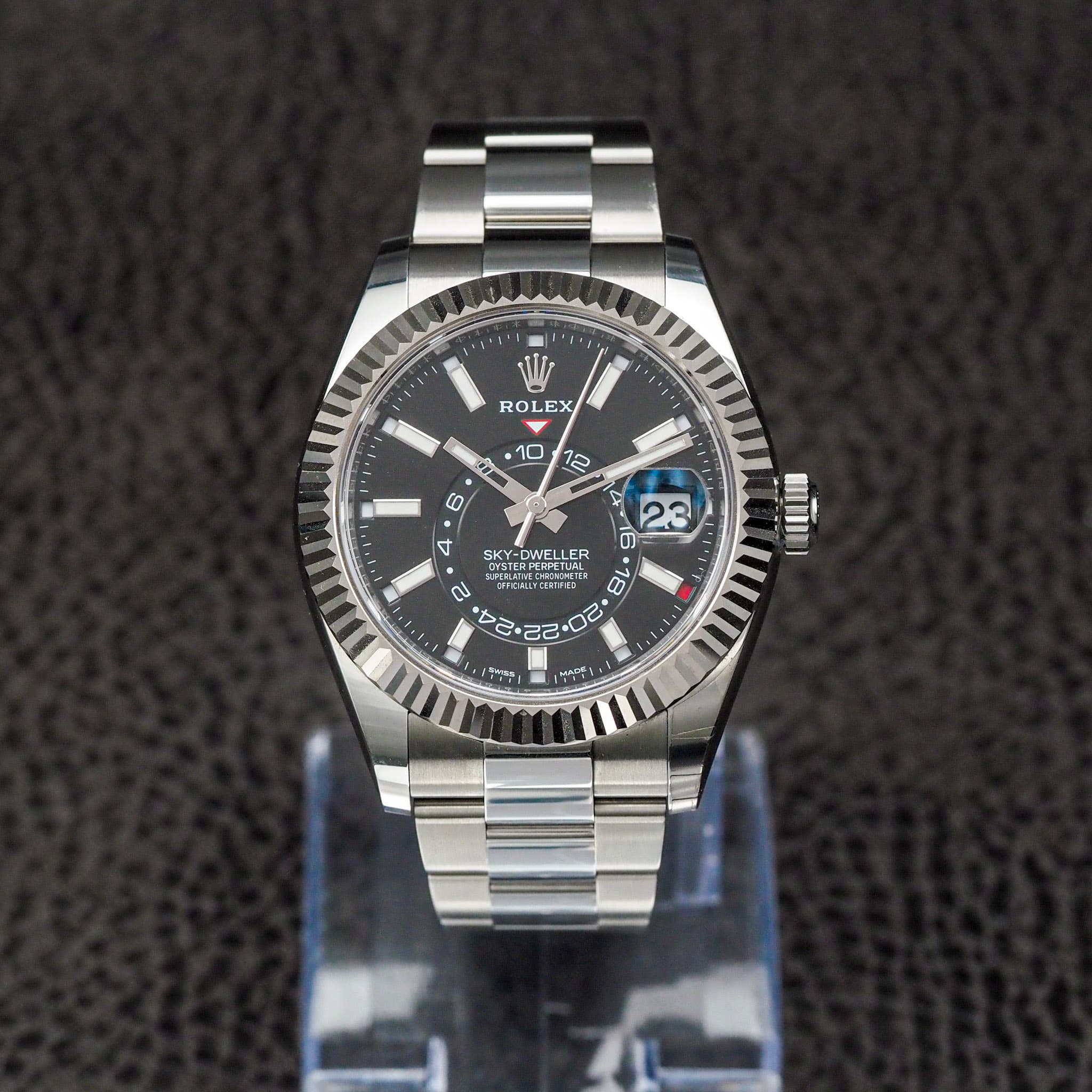 May be an image of wrist watch and text