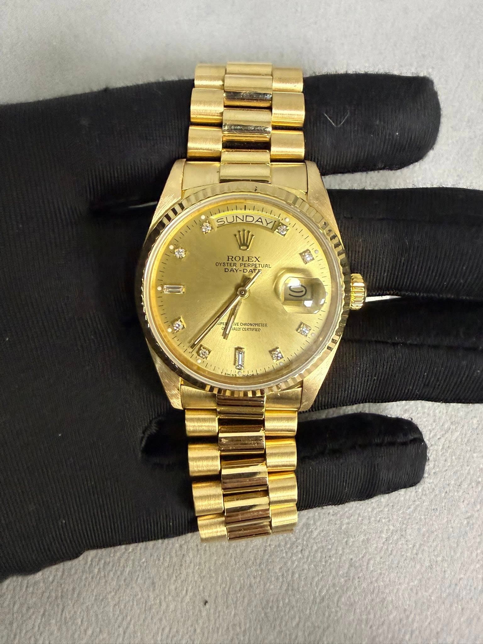 May be an image of wrist watch and text