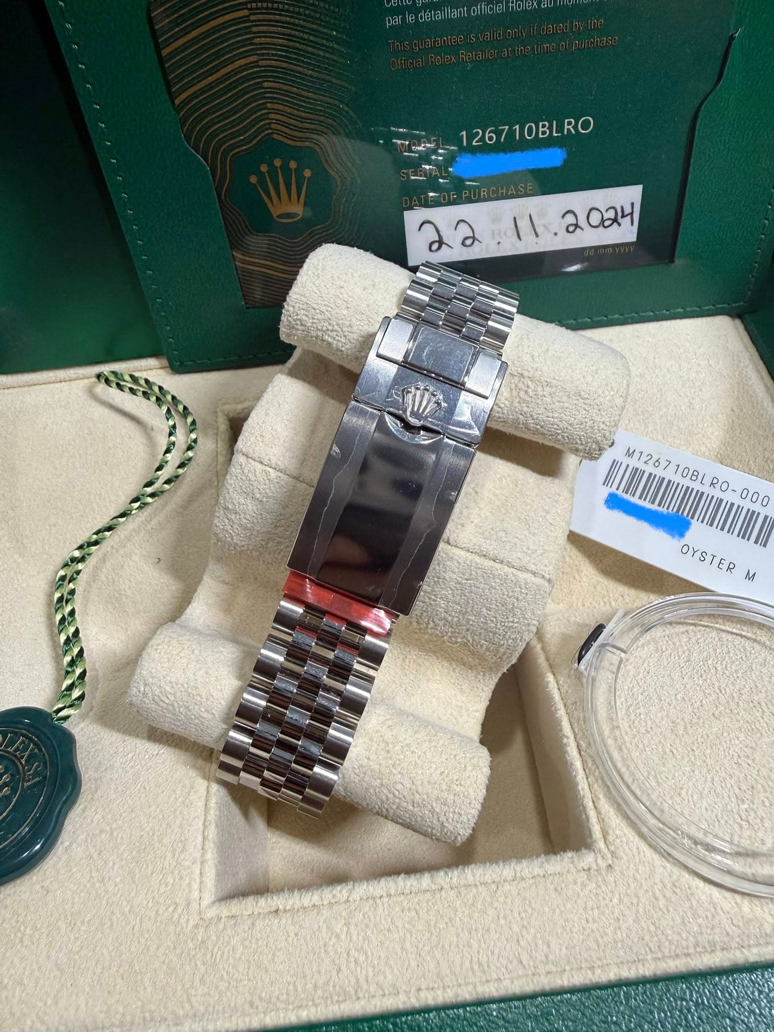 May be an image of wrist watch and text that says '126710BLRO 1267 10BLRO M126710BLR0-000 BL M1267 10BL 000 OYSTER OYSTER M'