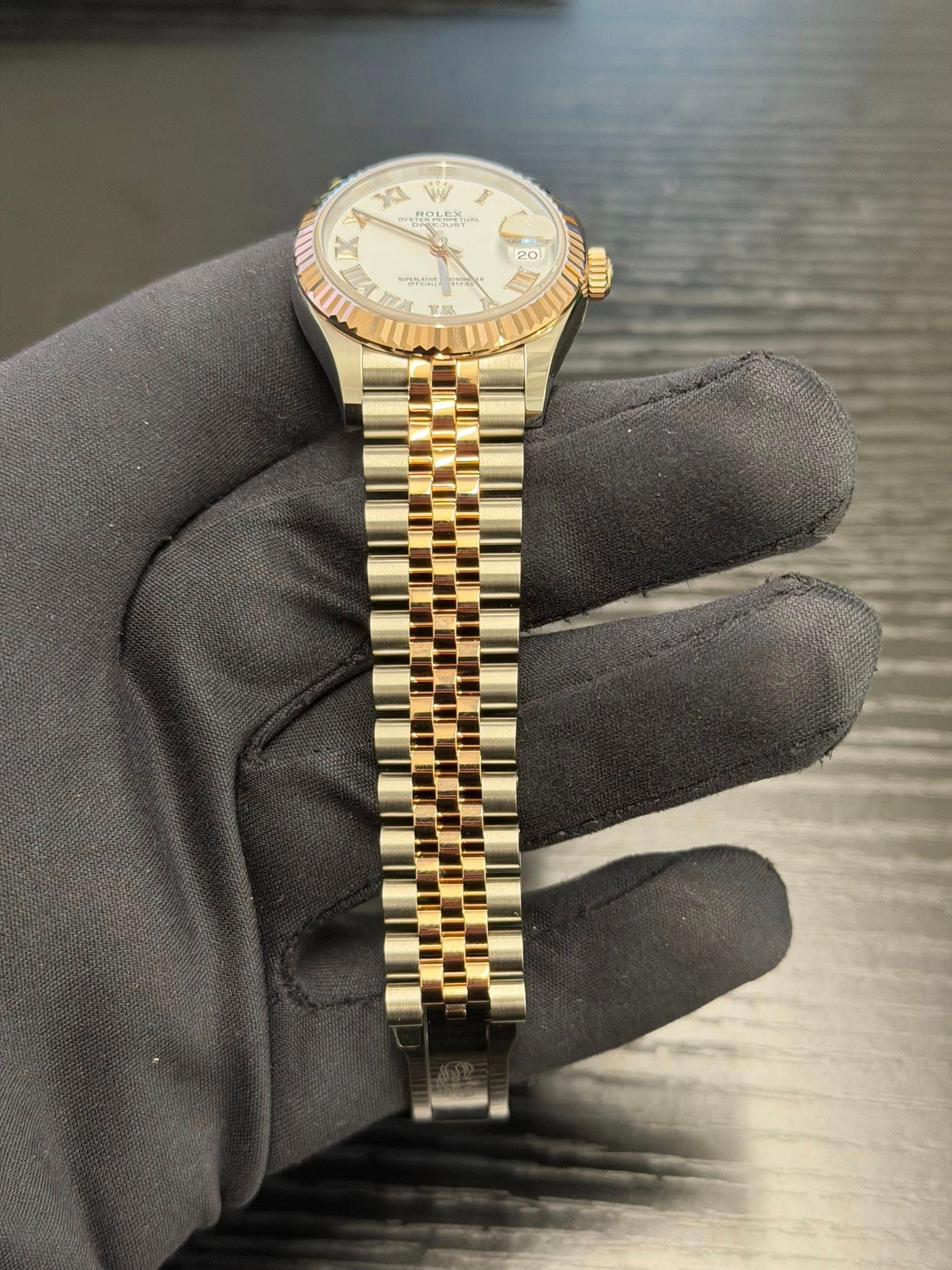 May be an image of wrist watch and text