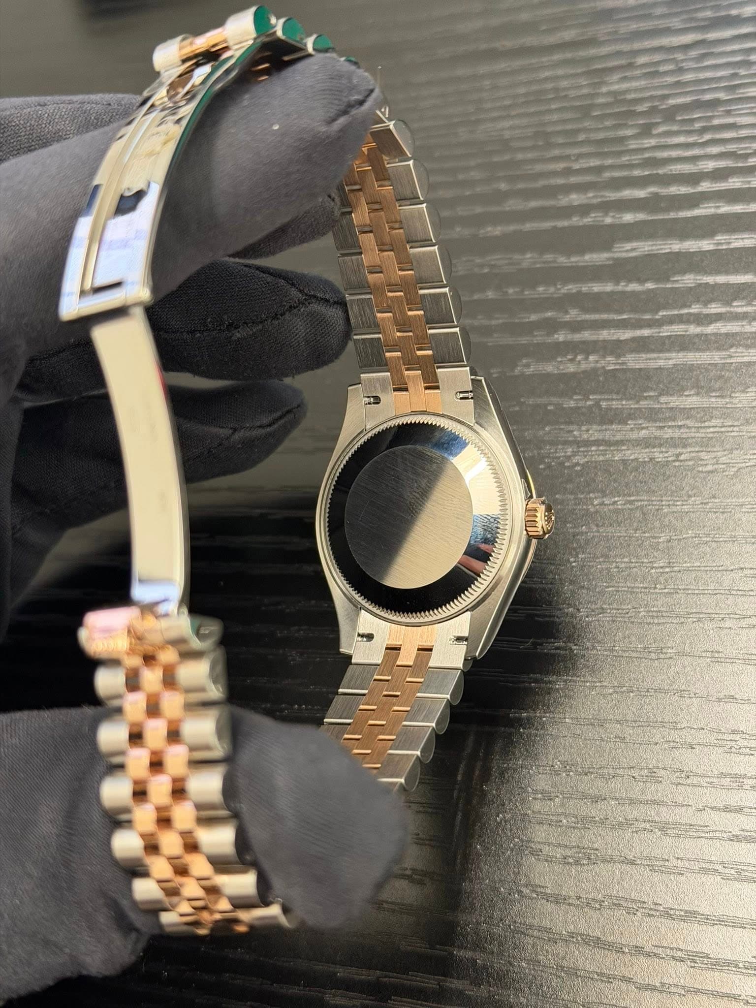 May be an image of wrist watch, jewelry and text
