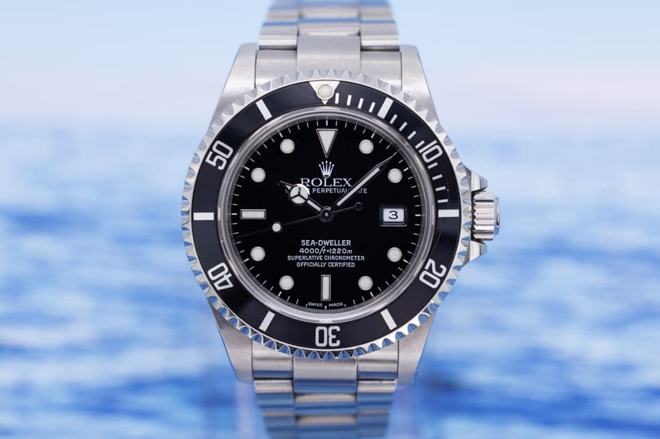 May be an image of wrist watch and text that says '50 ROLEX PERPETUAL PETUAI 10 I 3 MI SEA-DWELLER LETE 4000/t-1220m ERLATIVE EFICIALE ERLATIVECHRONONETER HRONOMETER OFFICIALLY…