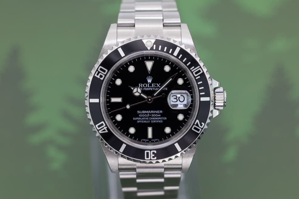 May be an image of wrist watch and text that says '50 ROLEX ODE 30 SUBMARINER 1000/t=300m 1000ft= =300m 300m SUPERLAT NCDLATINIE 1000/= PERLATIVE RONOMET RONOME OFFICIALLY…