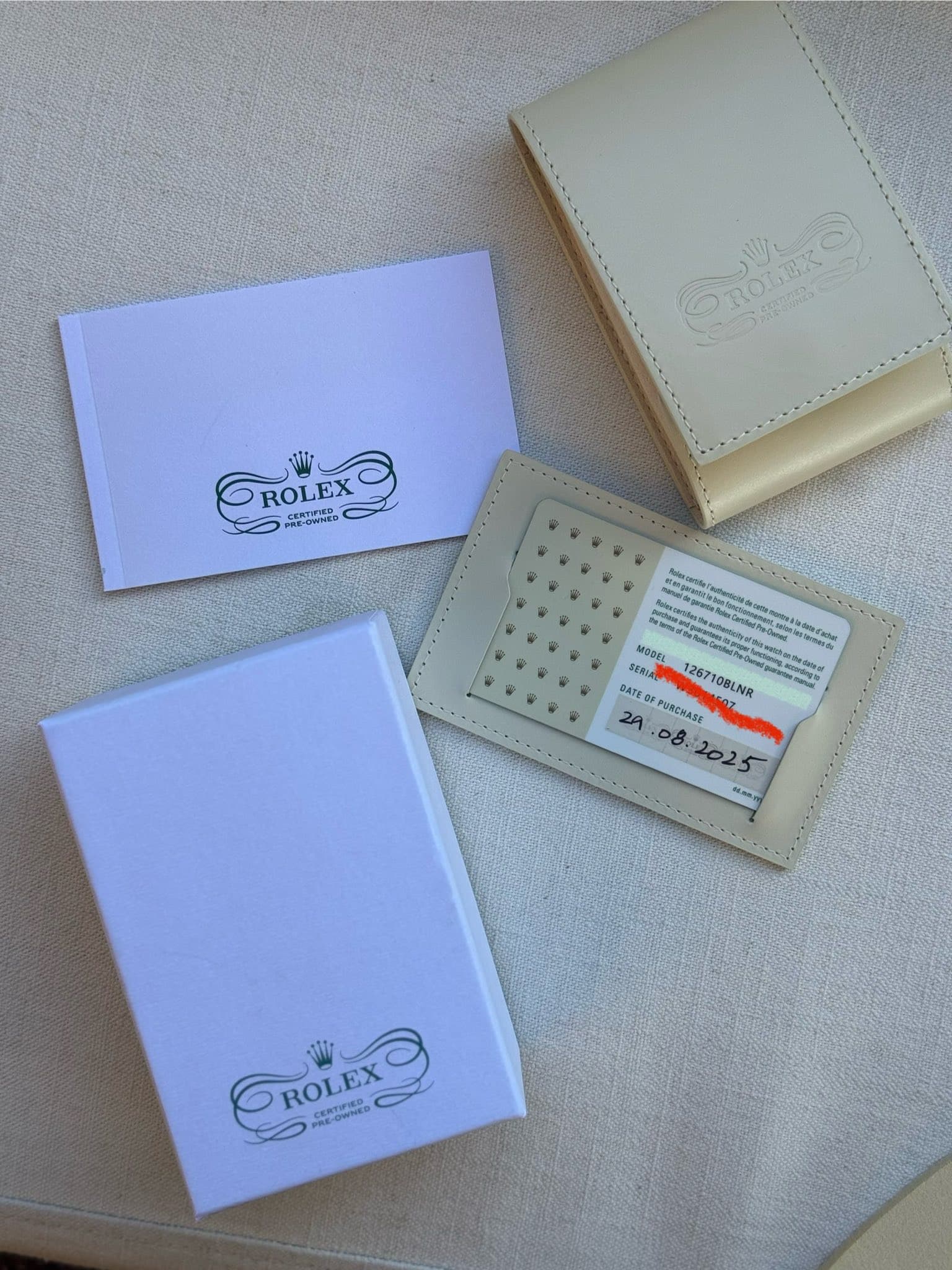 May be an image of saddle-stitched leather, book, leather, leather wallet and text