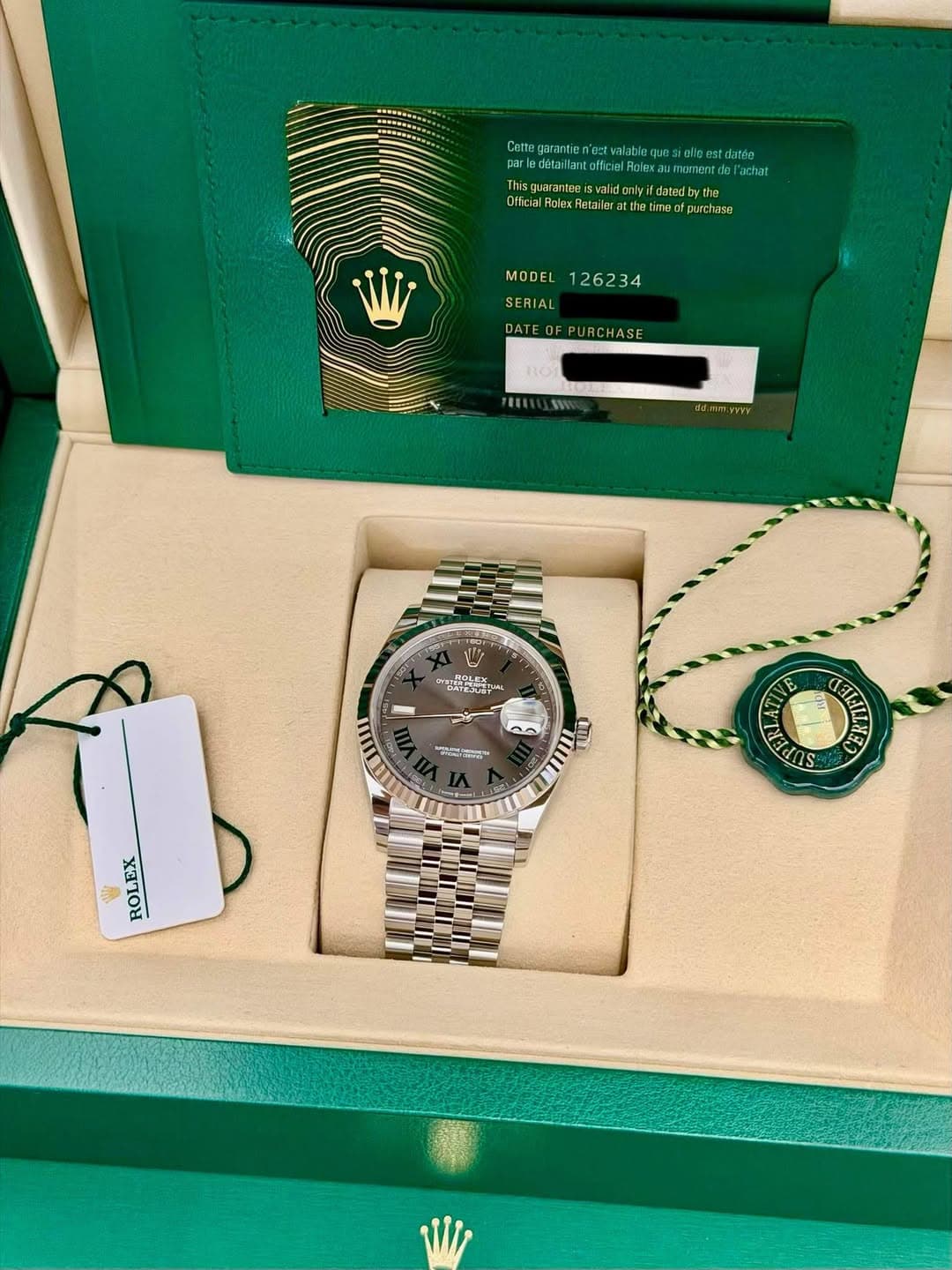 May be an image of wrist watch and text