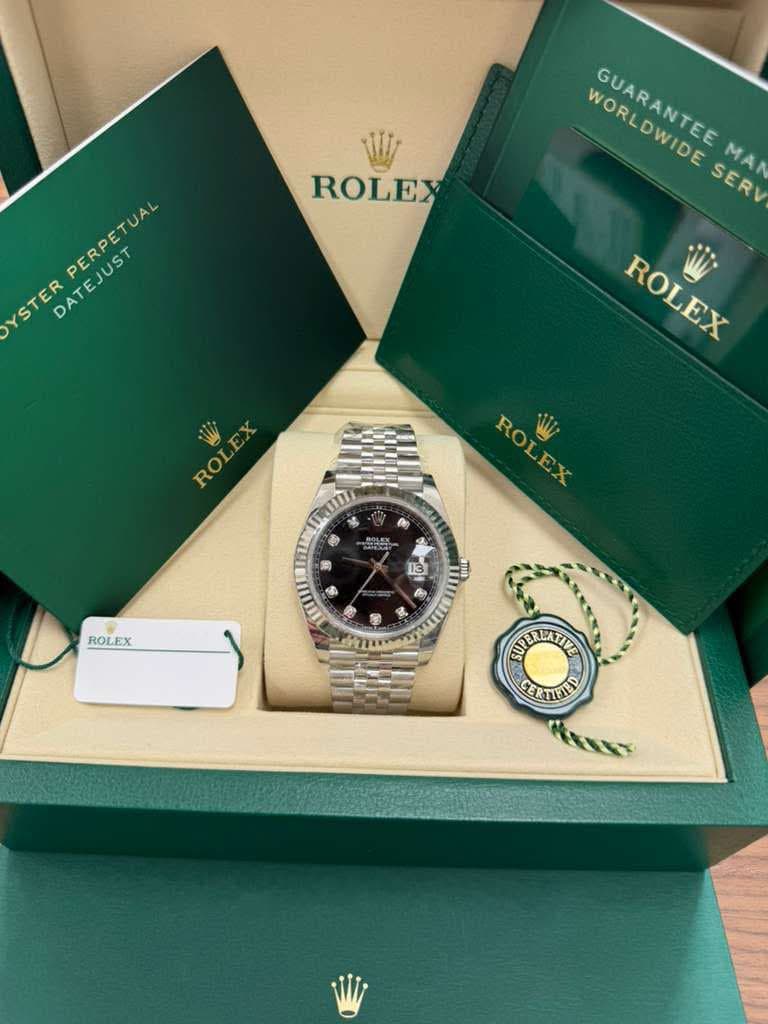 May be an image of wrist watch and text that says 'ROLEX WORLDWIDE ρb GUARANTEE SERV MAN YSTER DATEJUST PERPETUAL ROLEX ROLEX EX ROL O TOROII $ ゆ ROLEX 13 ROLEX IOW ه በ ynPAΥTC…