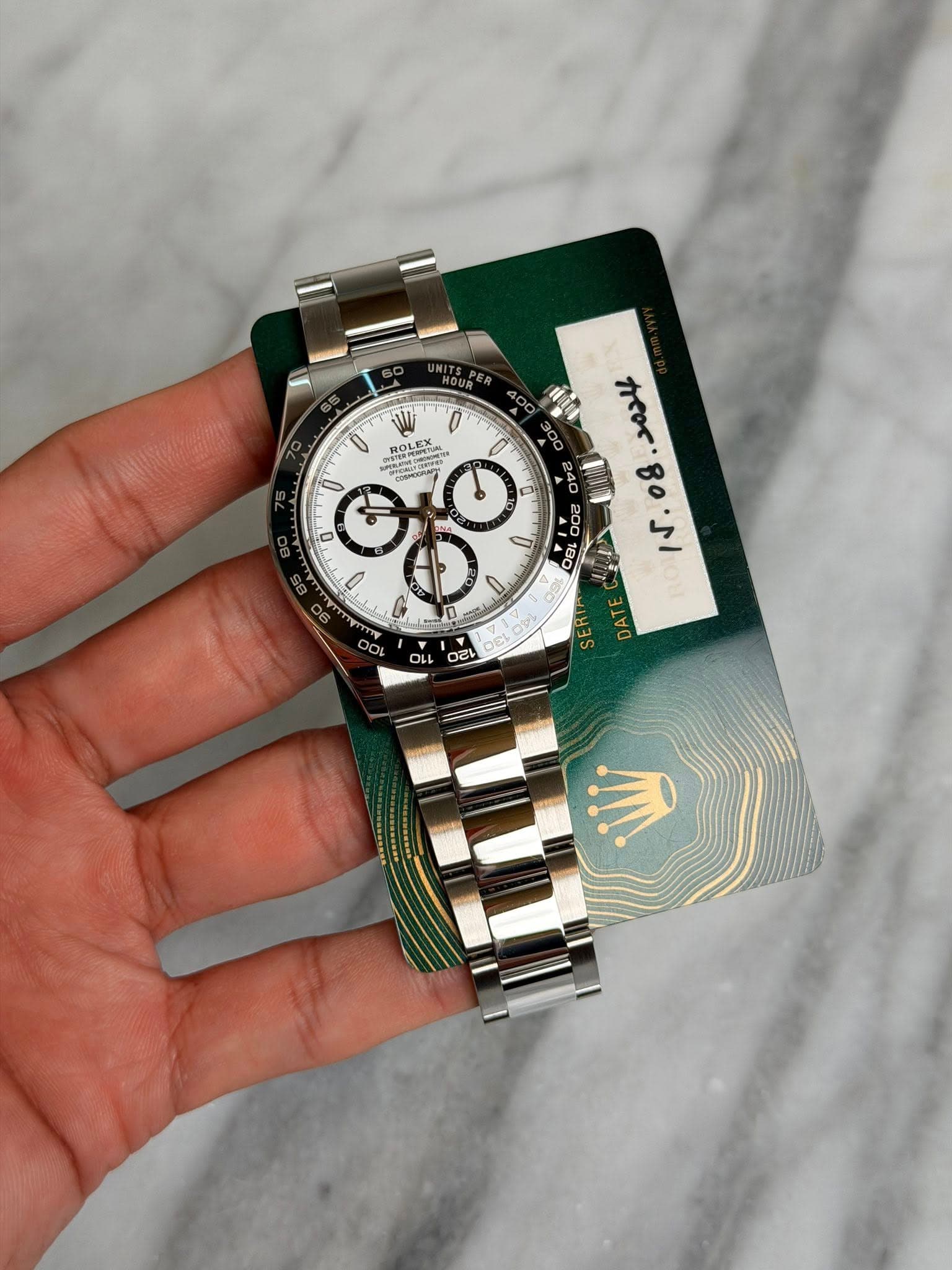 May be an image of wrist watch and text