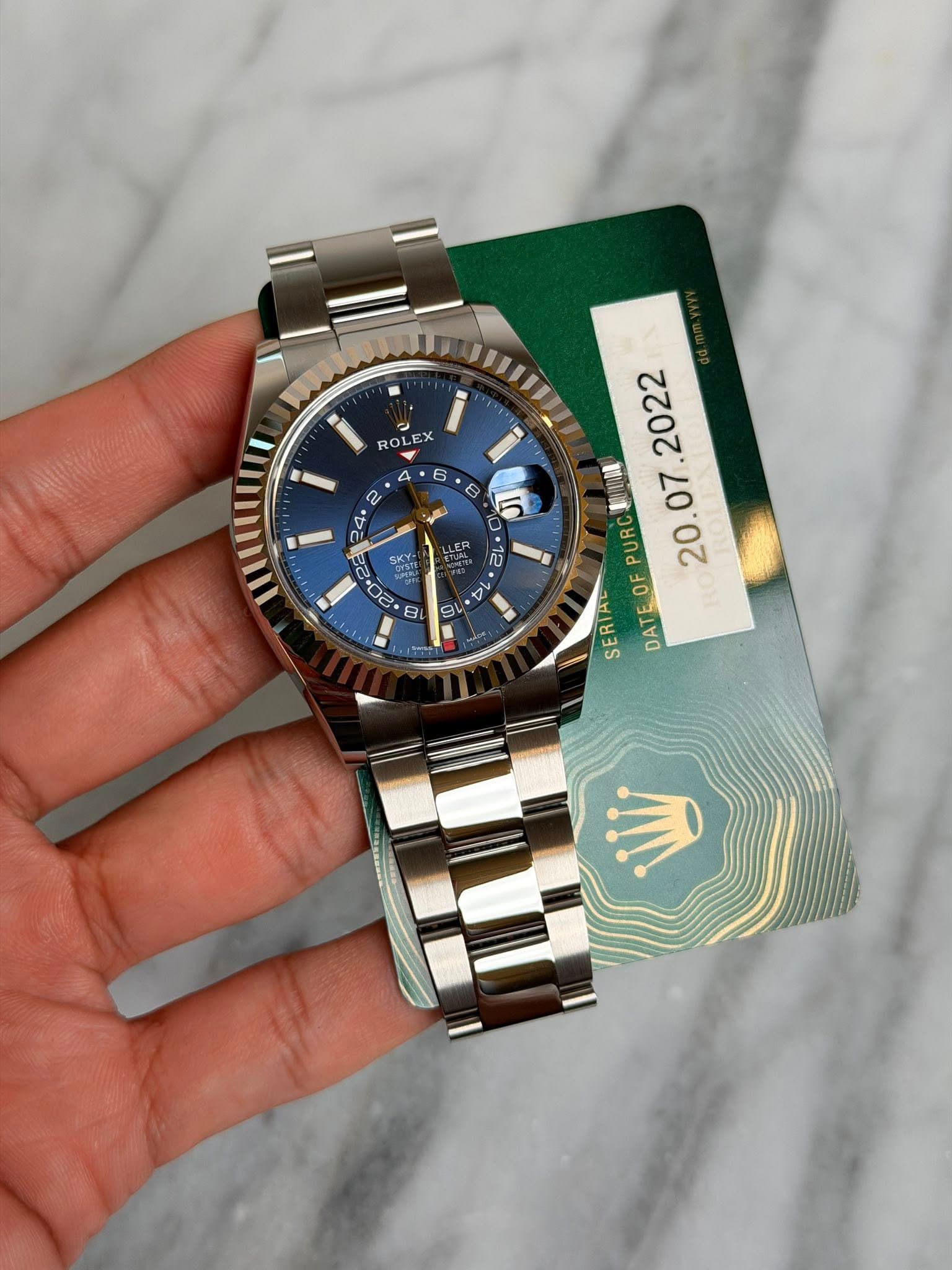 May be an image of wrist watch and text