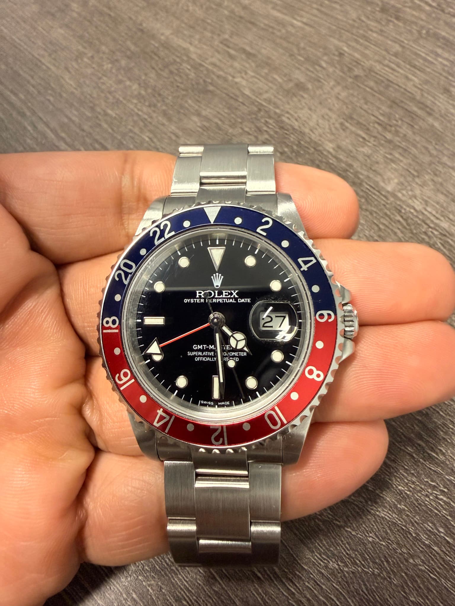 May be an image of wrist watch and text
