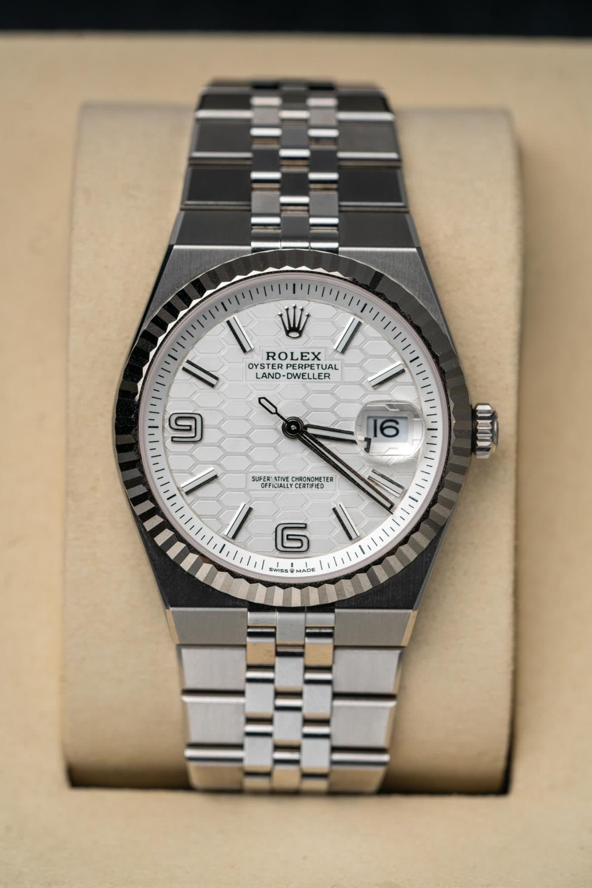 May be an image of wrist watch and text