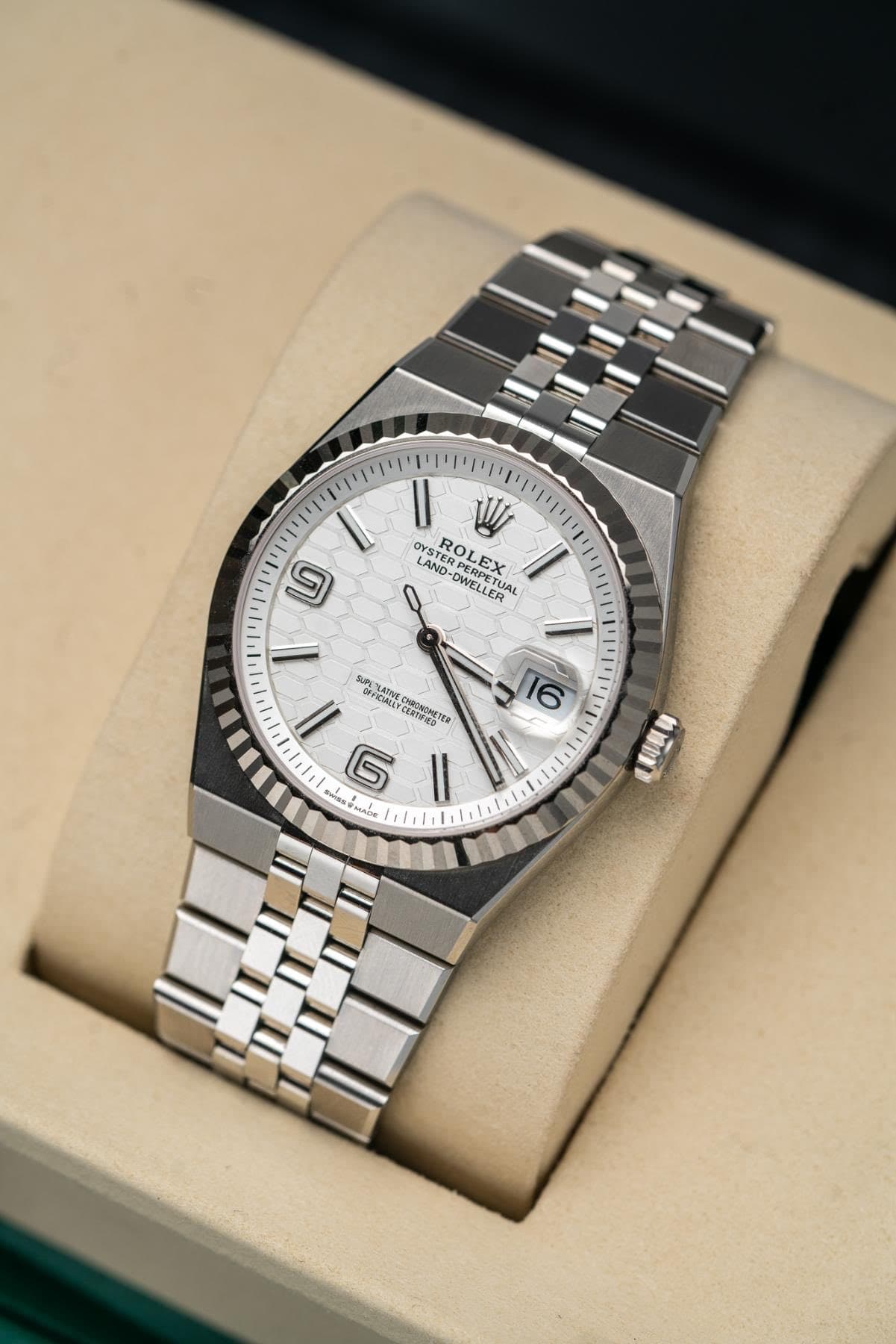 May be an image of wrist watch and text