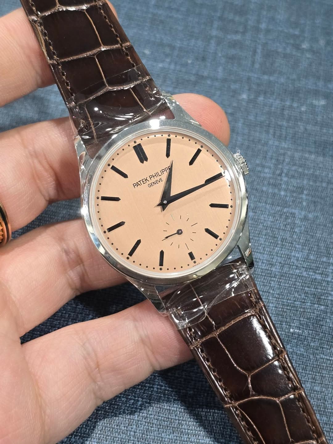 May be an image of wrist watch and text that says 'PHILIPPE PPP PATEK GENEVE F I I'