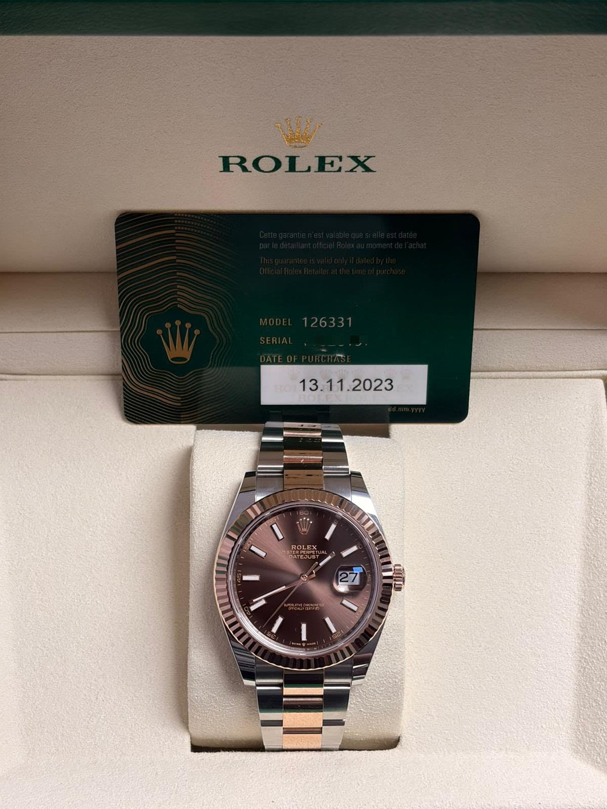 May be an image of wrist watch and text that says 'ROLEX عي ROLEX 2'