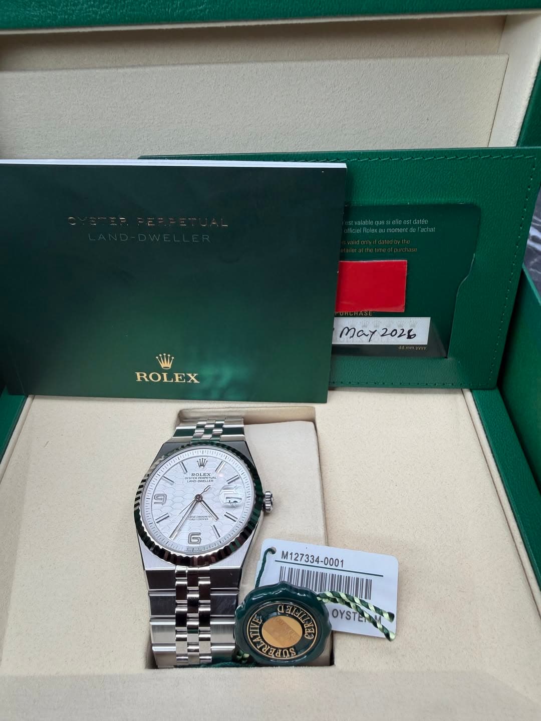 May be an image of wrist watch and text