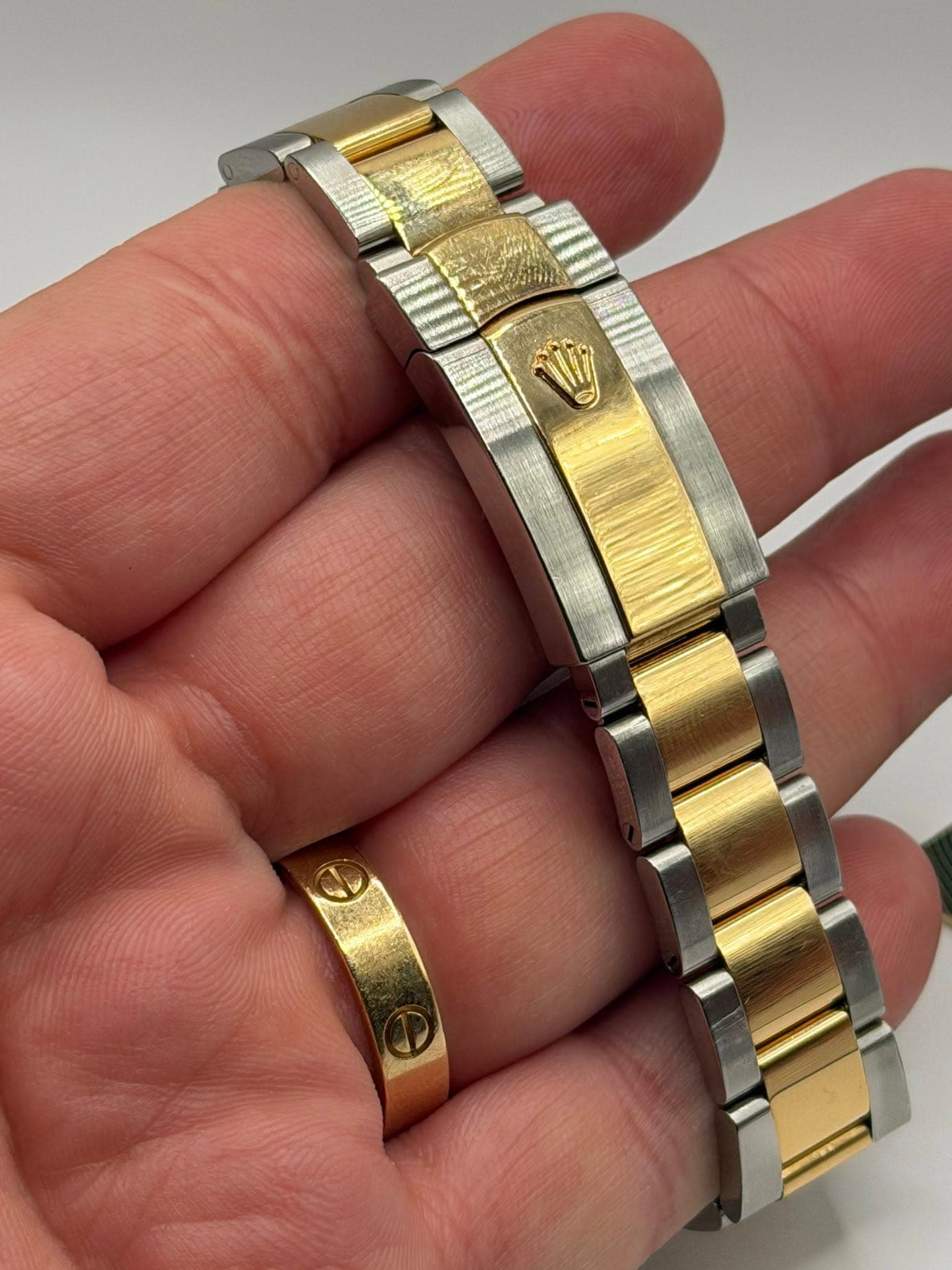 May be an image of jewelry and wrist watch