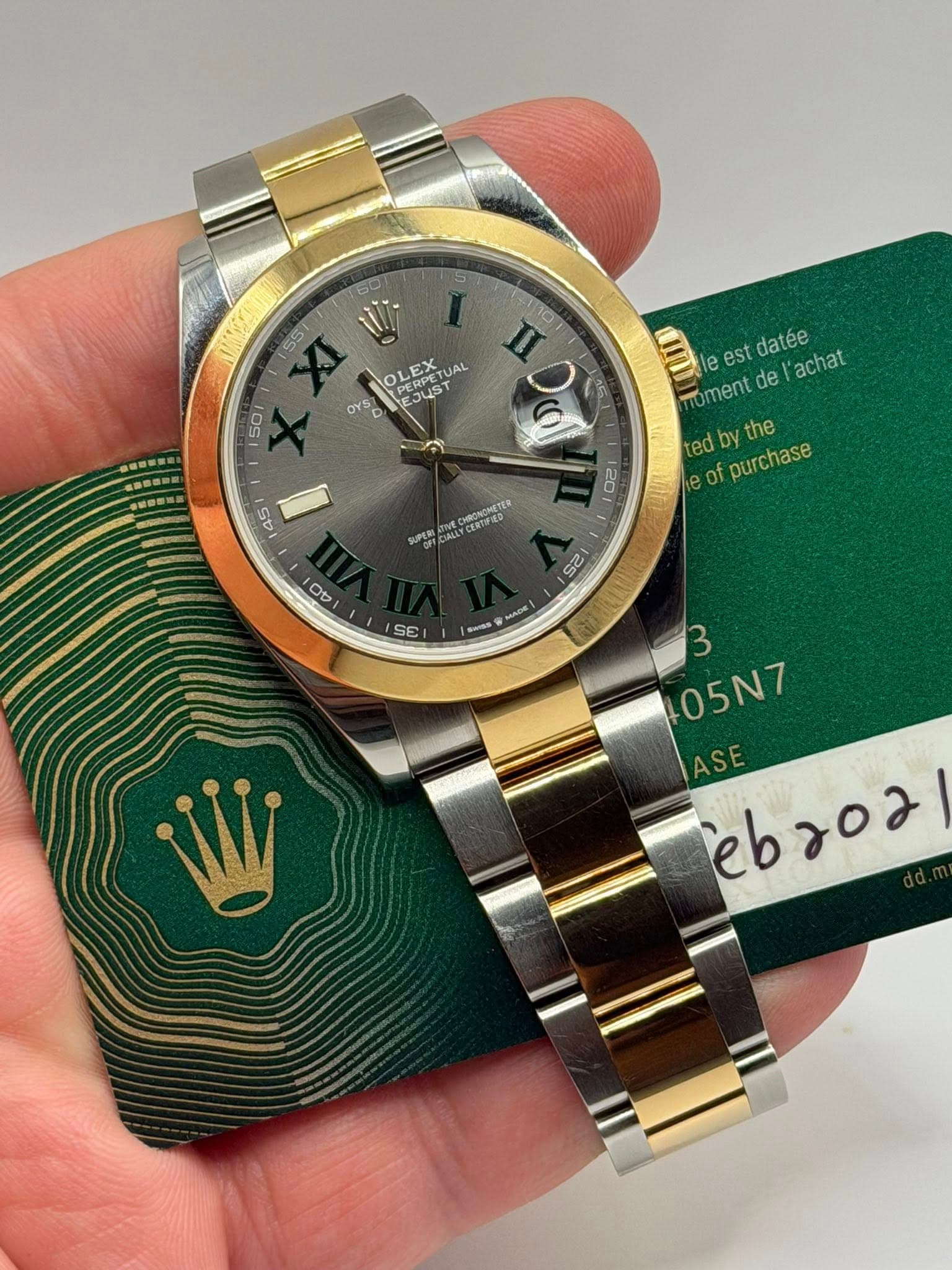 May be an image of wrist watch and text that says '60 5 551 OLEX. EDORTUAL PERPETUAL EX TUAL PERP JUS RPETU UST OYS II 10 O 5 50 le est datee oment de achat ed dby D DV y the e of…