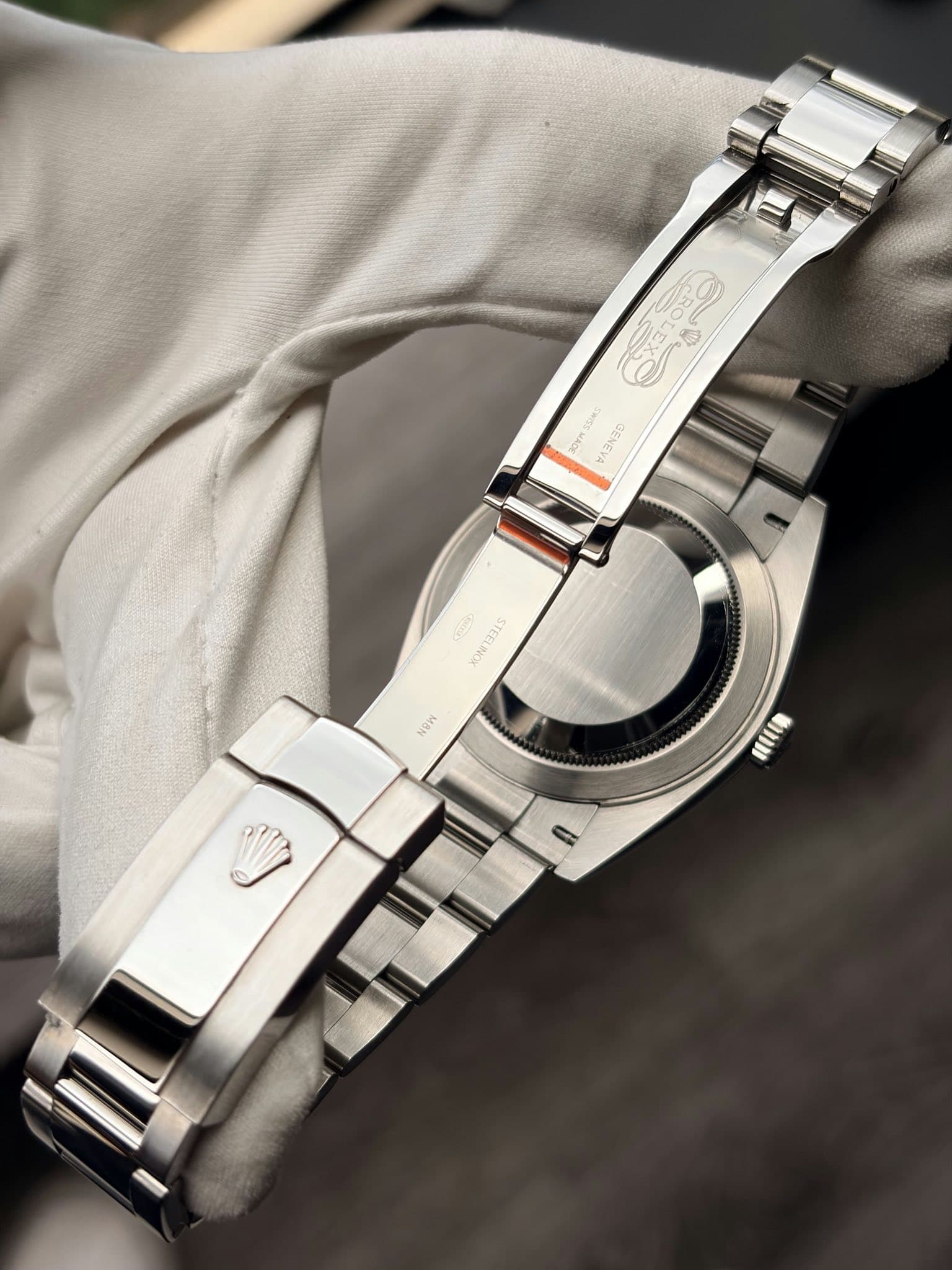 May be an image of wrist watch and text
