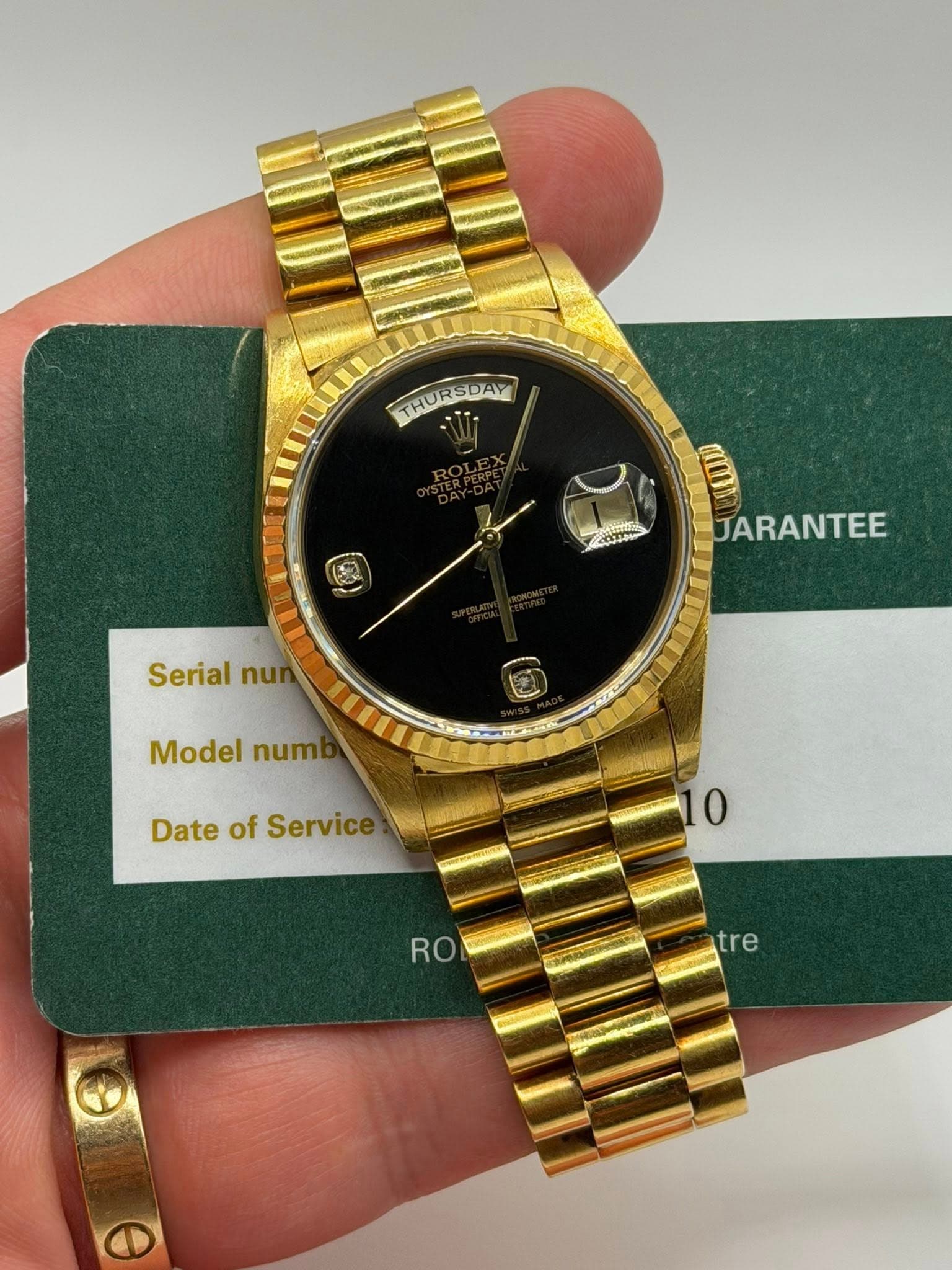 May be an image of wrist watch and text that says 'THURSDAY THUR THURSDAY NUDE COT I JARANTEE Serial Serialnu nui Model num Date of Service 0 RO tre e'
