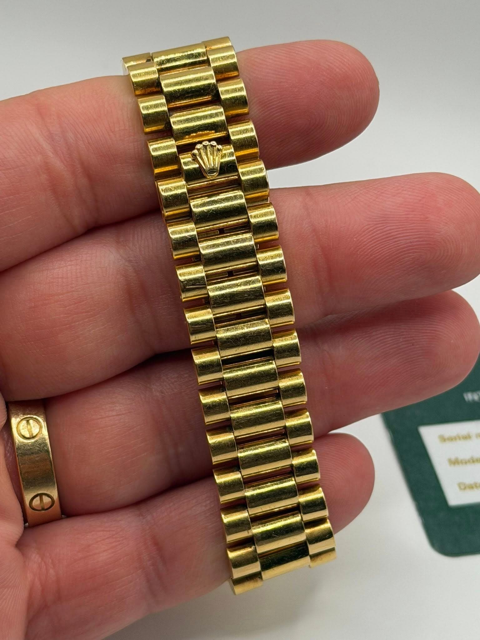 May be an image of wrist watch and text