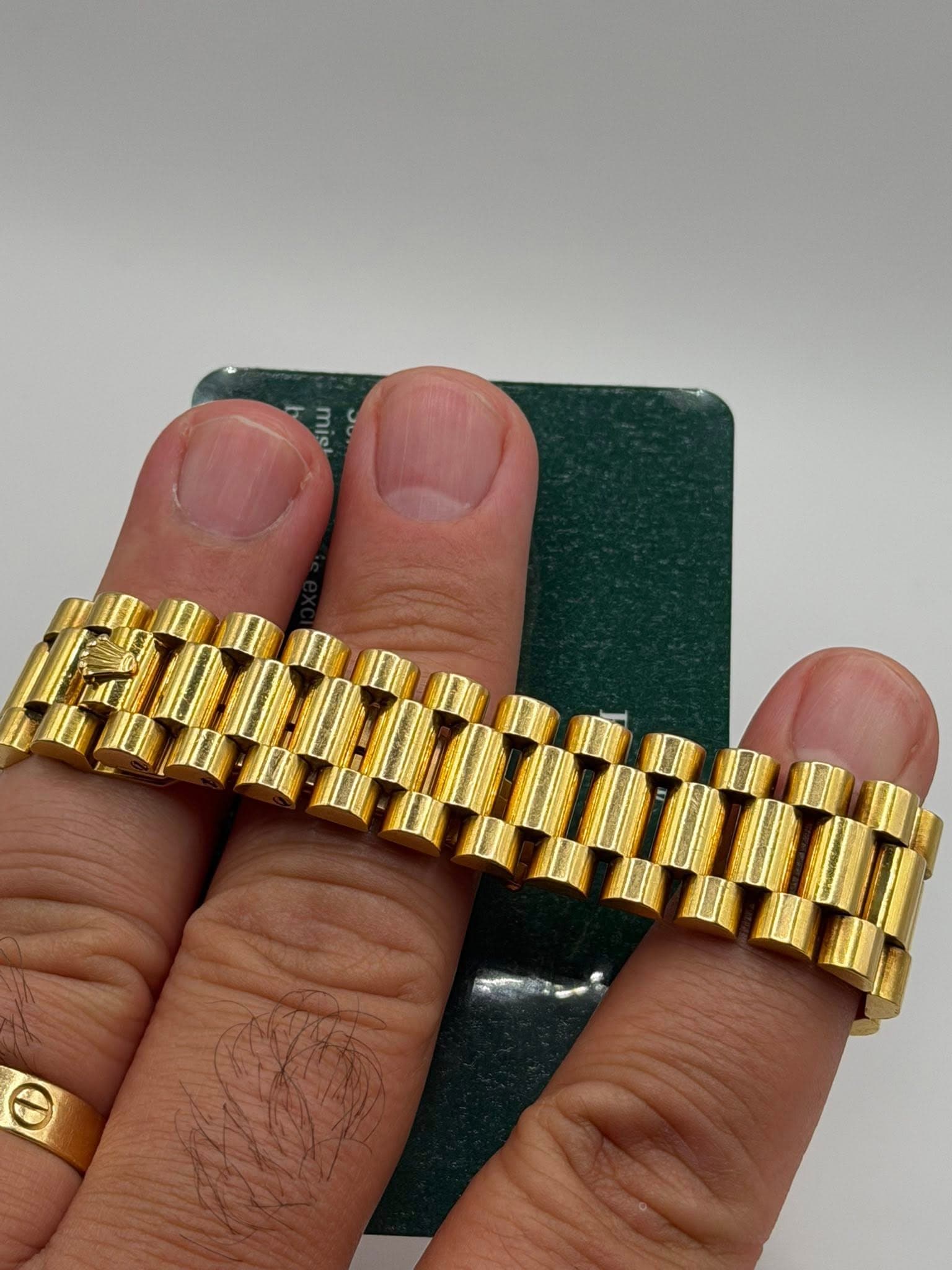 May be an image of ring, wrist watch and text