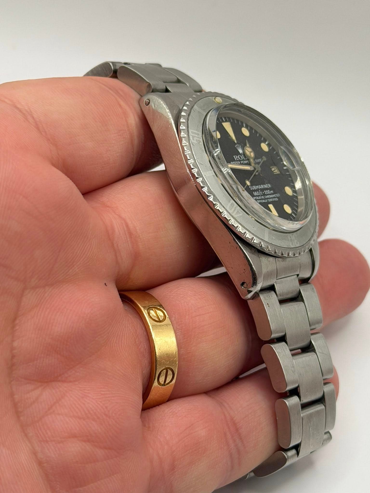 May be an image of wrist watch and text