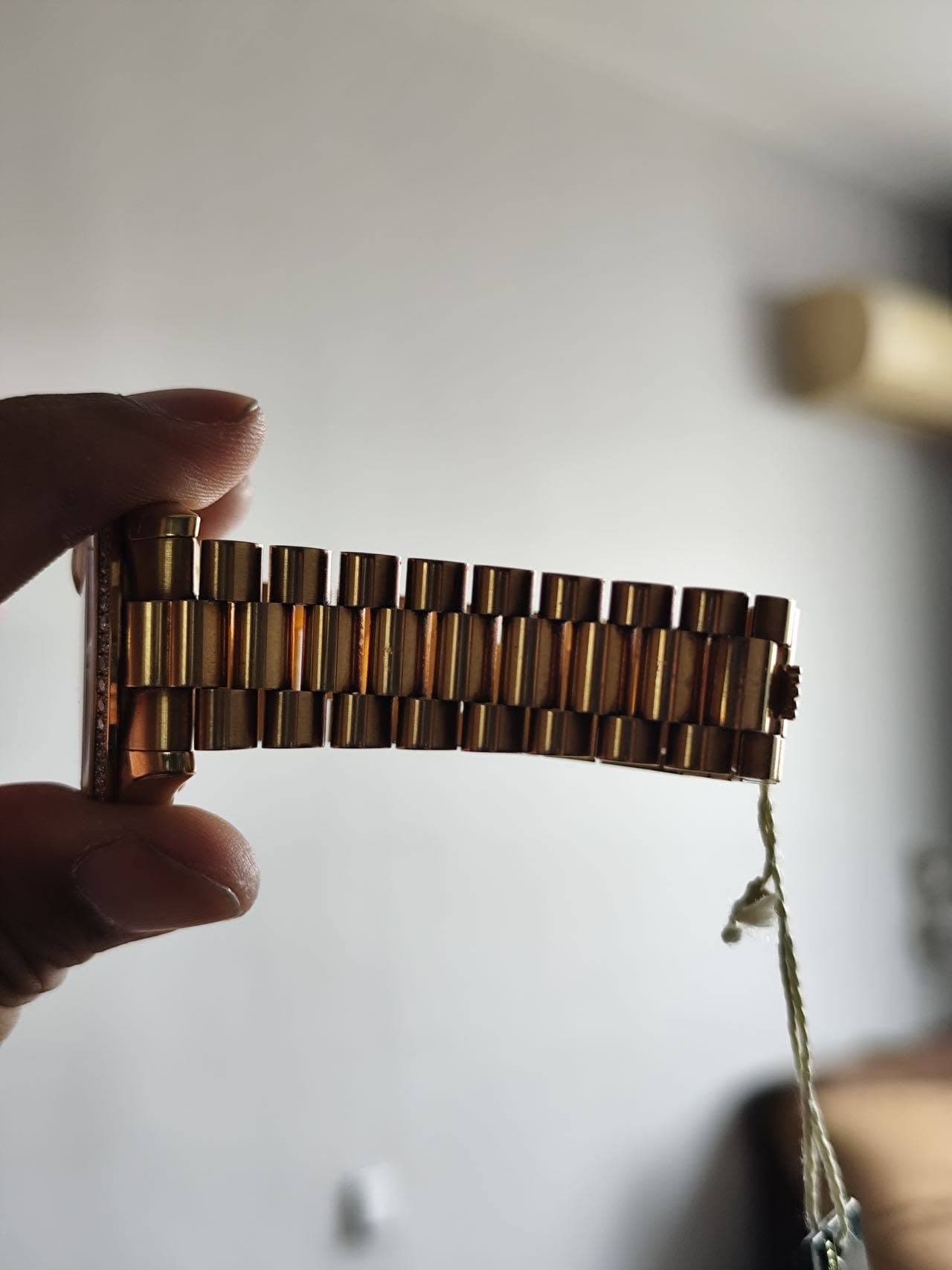 May be an image of brass, wrist watch and childrens toy