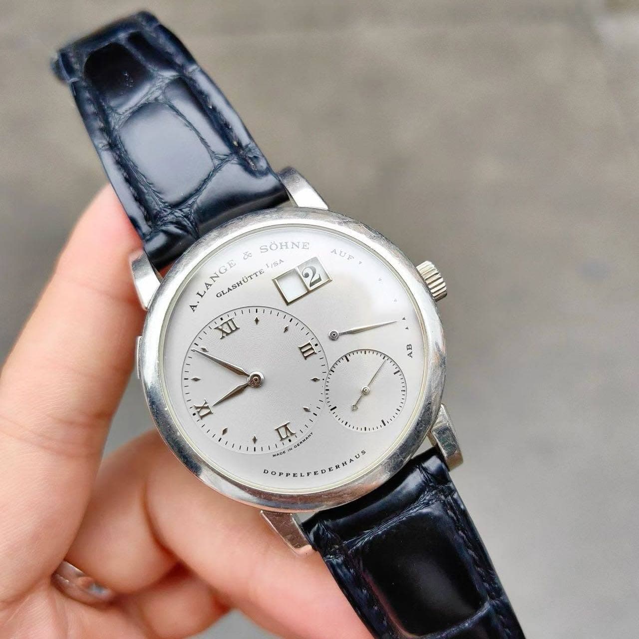 May be an image of wrist watch and text