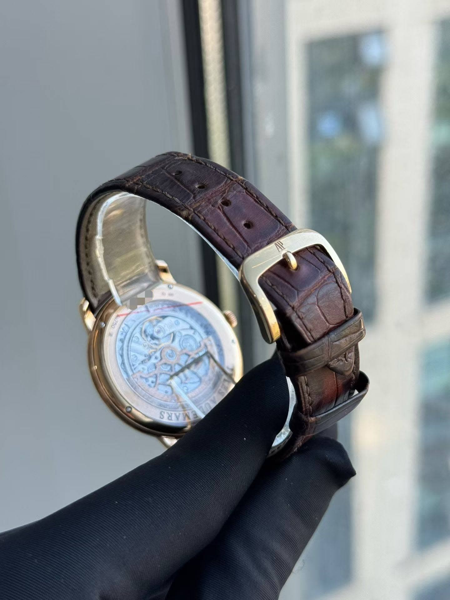 May be an image of wrist watch and text