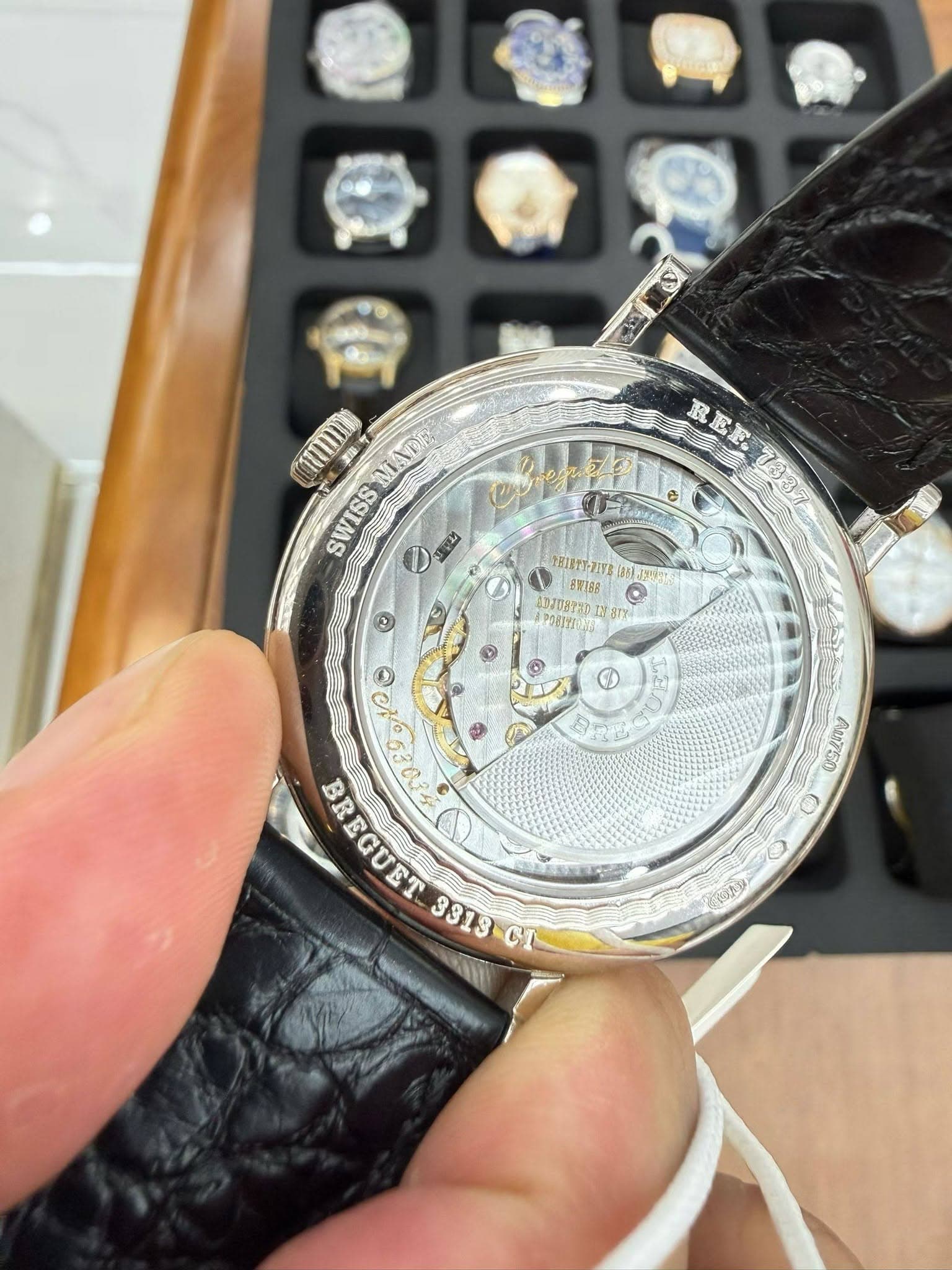 May be an image of wrist watch and text