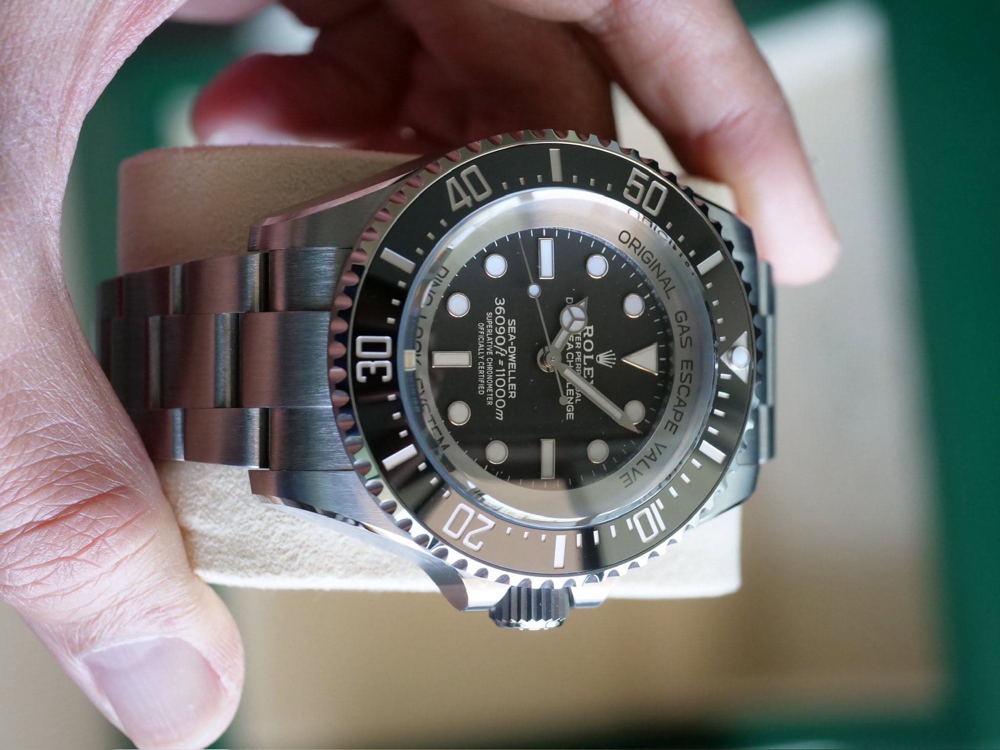May be an image of wrist watch and text