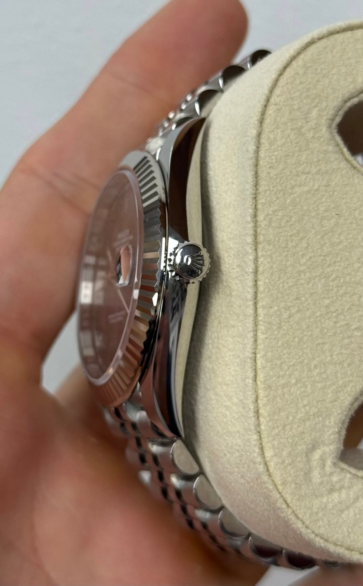 May be an image of wrist watch and text