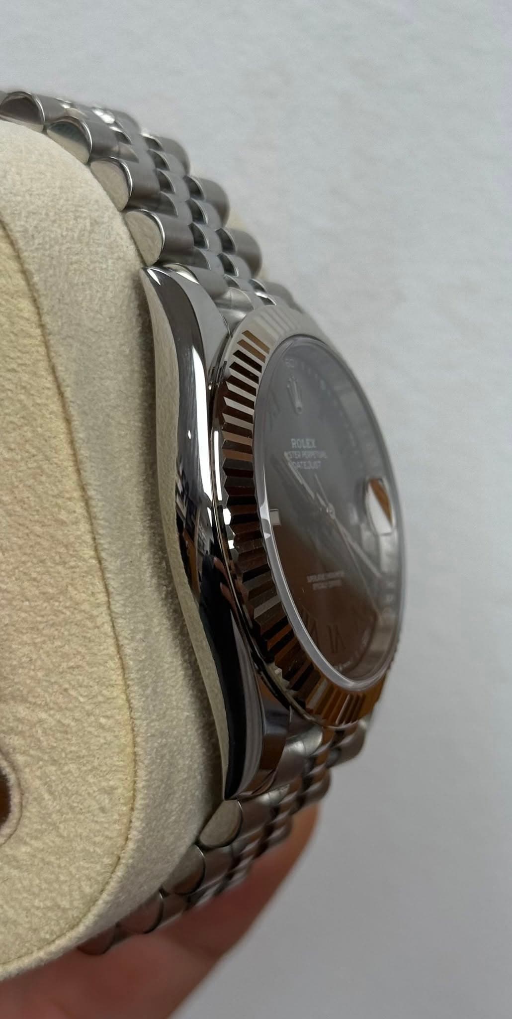 May be an image of wrist watch and text
