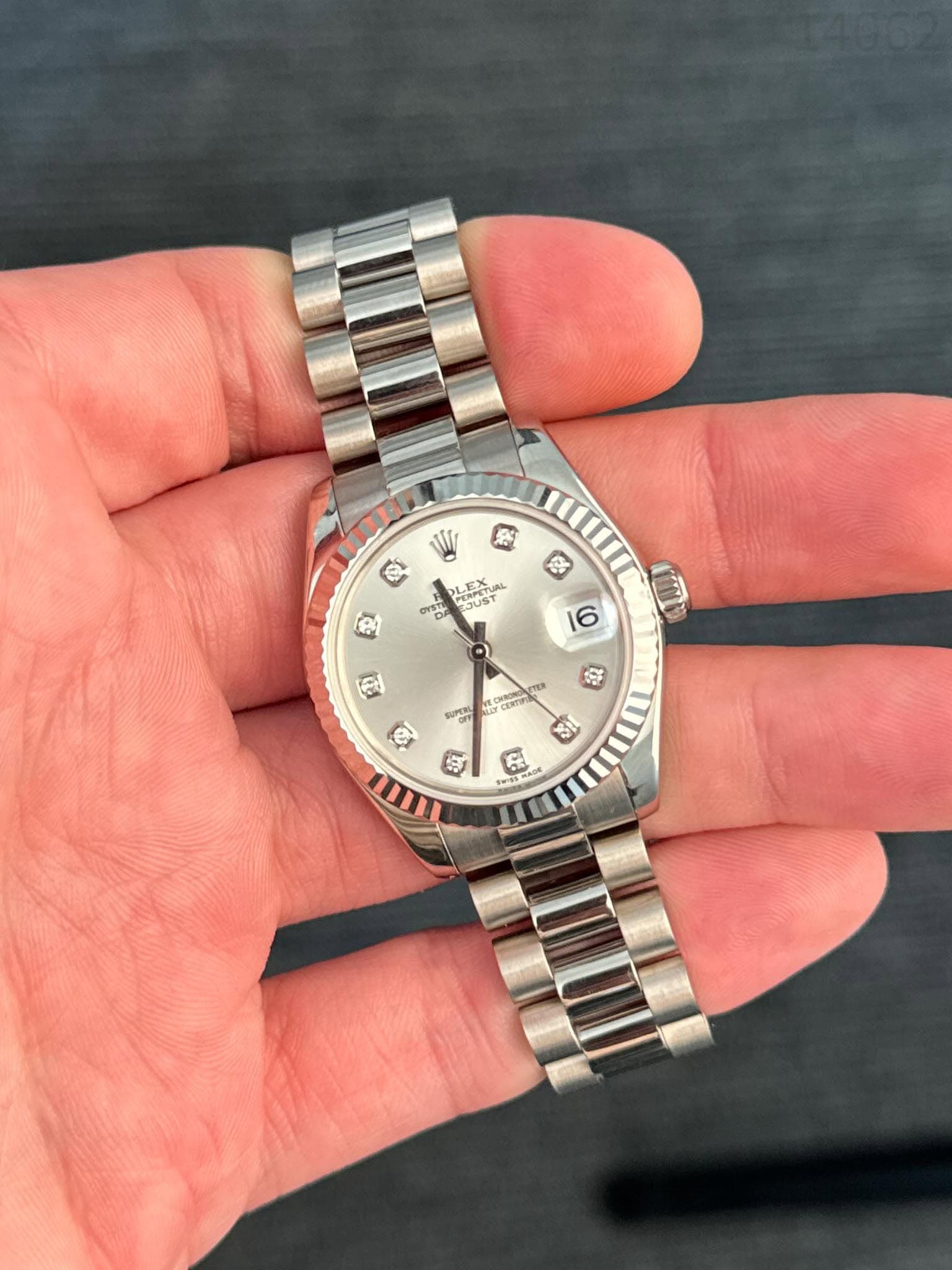 May be an image of wrist watch and text