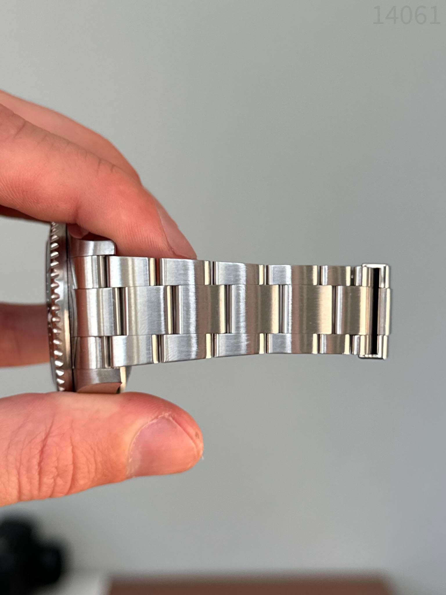 May be an image of wrist watch and text