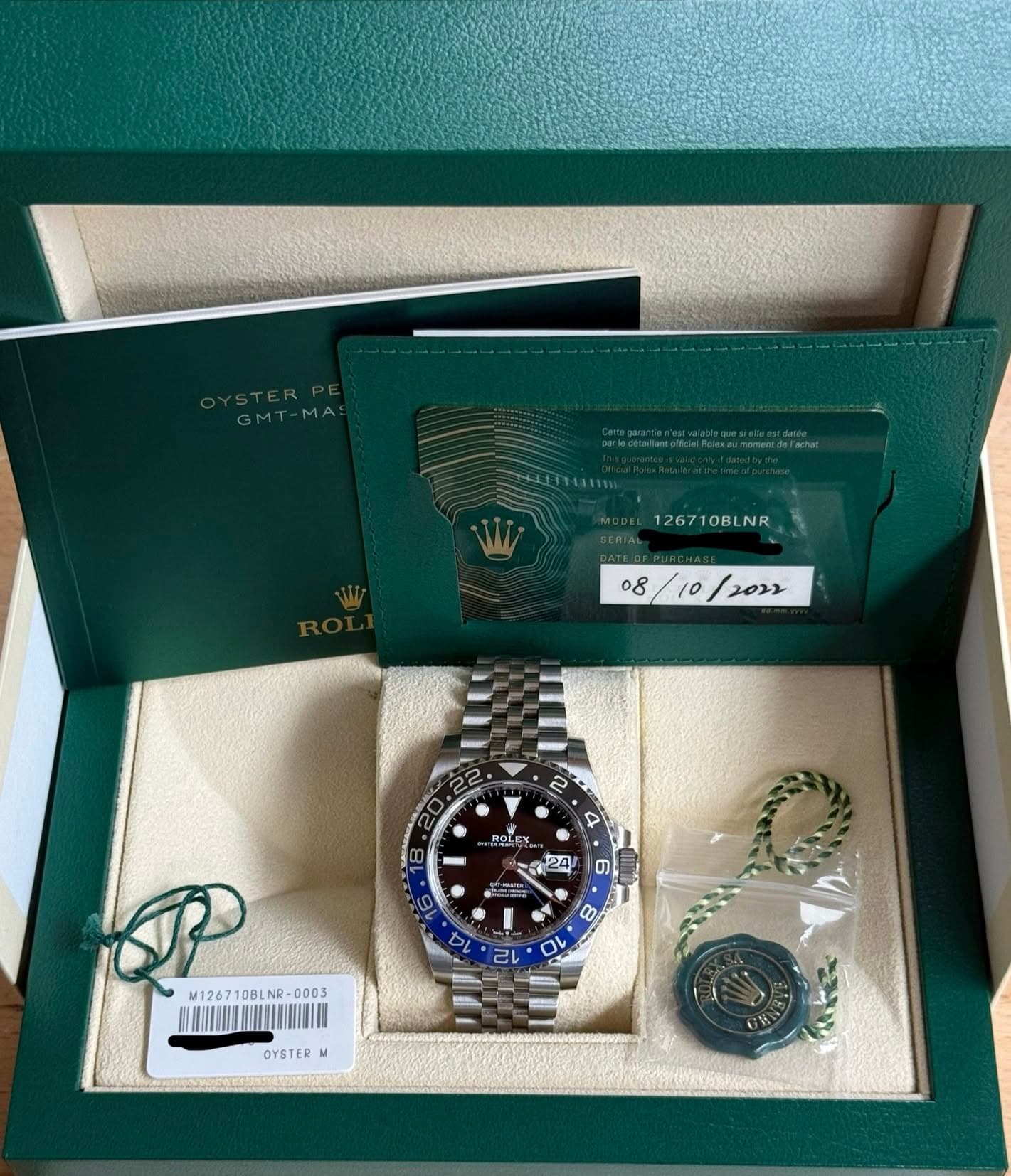 May be an image of wrist watch and text that says 'GMT-MAS 1267 126710BLNR 126710BLNR OB NR 08/10/2022 10 / JRLSY P5Y 24 24 ゴ味ト ግ 80 C M126710BLNR-0003 NR 0003 M1267 10BLNA 10B…