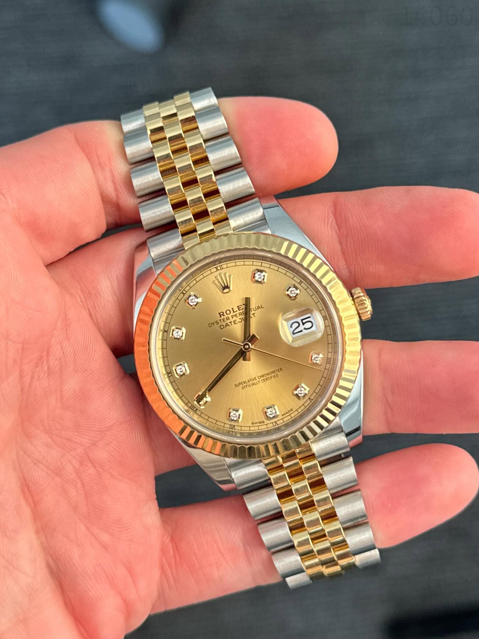 May be an image of wrist watch and text