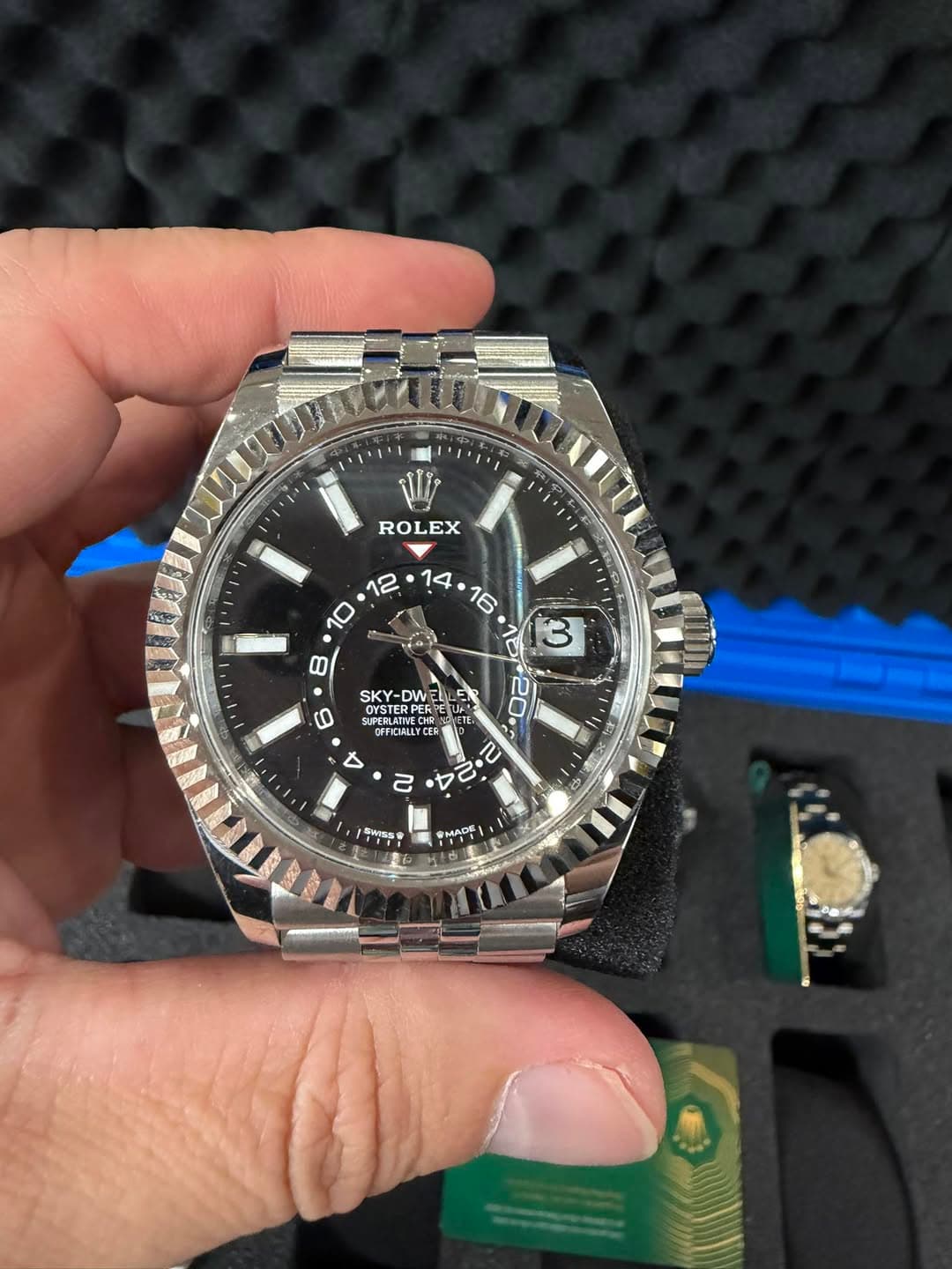 May be an image of wrist watch and text